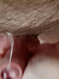Kristina, an older blonde woman, poses on a kitchen counter