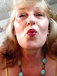 An older woman with a passion for penises appears partially nude