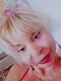 A hot slim businesswoman is getting undressed in a series of provocative shots